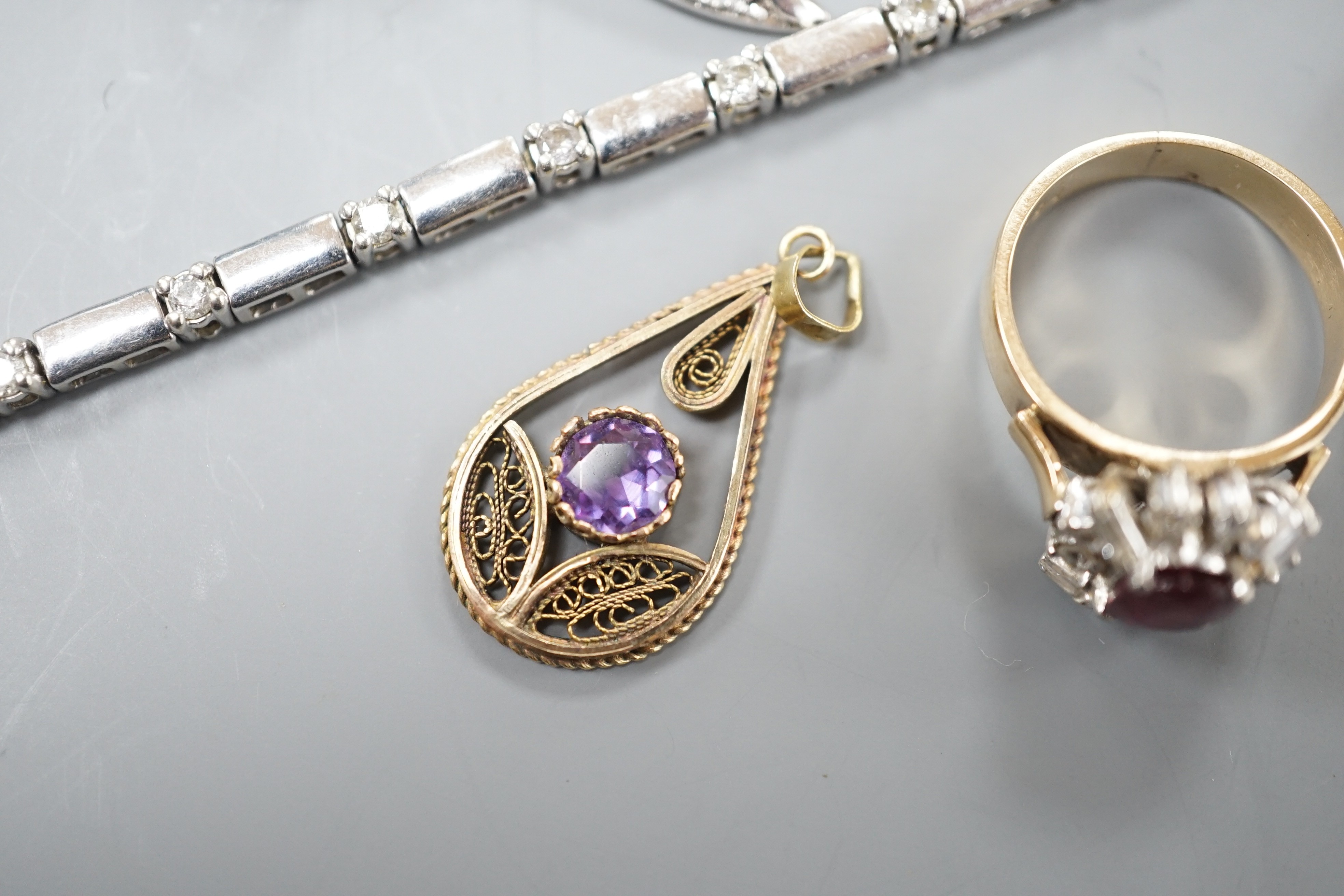 A 9kt white metal and diamond set bracelet, a 9ct mounted agate brooch, two rings including 18k, two pendants and a pair of modern diamond set ear studs.